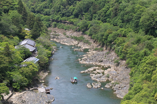 Kyoto Japan - May 6, 2015: People take Hozu river cruise in  Arashiyama Kyoto Japan.