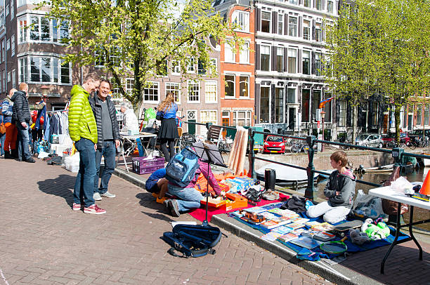 Locals display their old things for sale on King's Day. stock photo