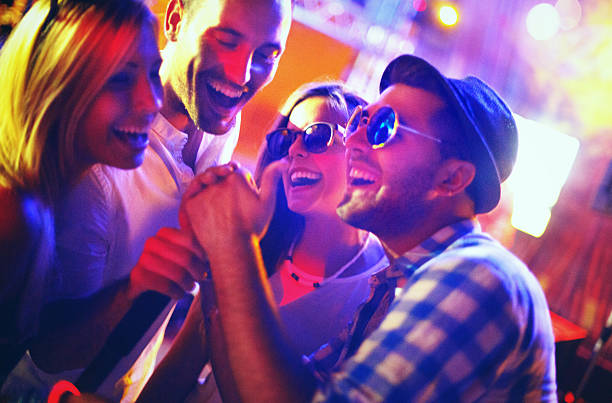 istock Group of people on a karaoke contest. 484053662