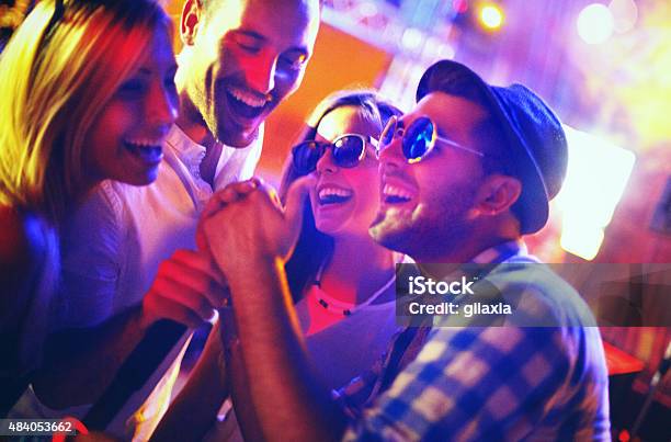 Group Of People On A Karaoke Contest Stock Photo - Download Image Now - Karaoke, Choir, Microphone