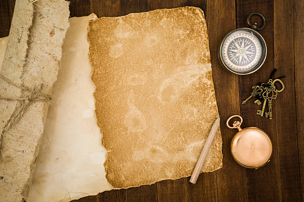 istock Old paper, compass, pocket watch on wooden background 484056390