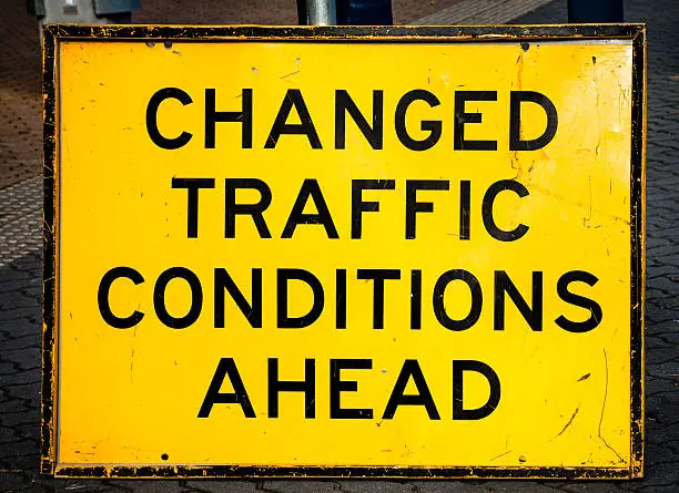 Photo of Scratched and Damaged Street Sign Warning CHANGED TRAFFIC CONDITIONS AHEAD