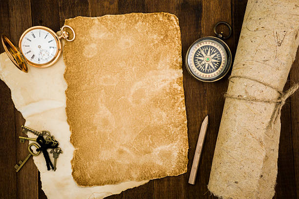 istock Old paper, compass, pocket watch on wooden background 484058474