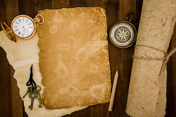 istock Old paper, compass, pocket watch on wooden background 484058482