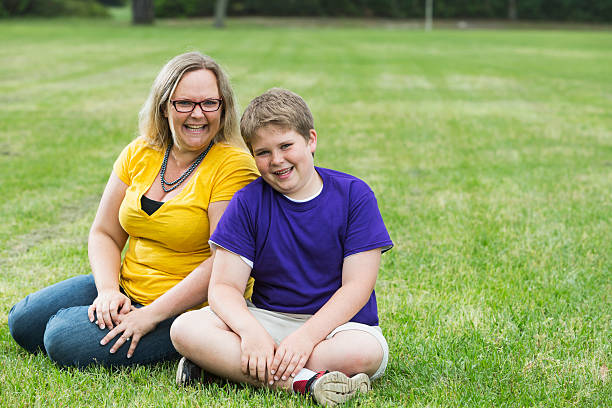 istock Mother and son laughing in the park 484065322