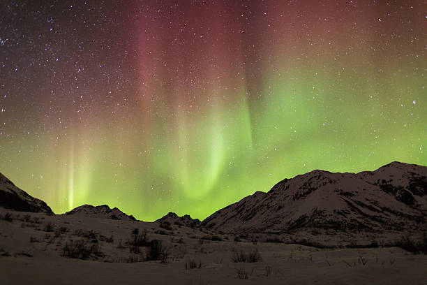 istock Aurora Borealis with red and green streaks 484067165