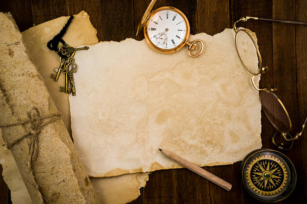istock Old paper, compass, pocket watch on wooden background 484067416