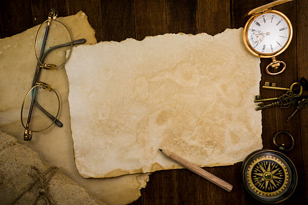 istock Old paper, compass, pocket watch on wooden background 484067422