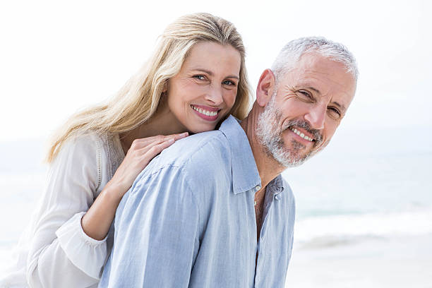 istock Happy couple hugging each other and smiling at camera 484068200