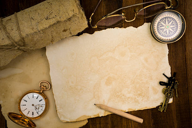 istock Old paper, compass, pocket watch on wooden background 484068476