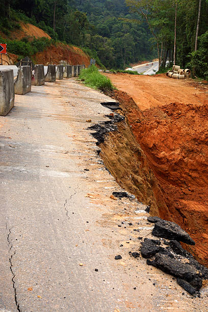 istock Side of the broken asphalt road collapsed and fallen, 484069621