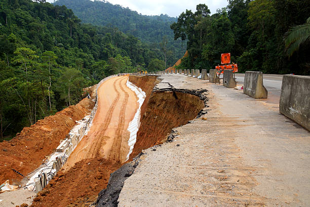 istock Side of the broken asphalt road collapsed and fallen, 484069685