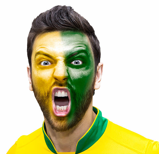 istock Brazilian soccer player celebrates on white background 484073168