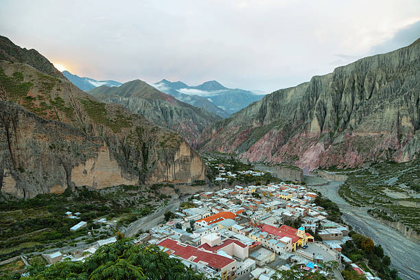 View of Iruya village and multicolored mountains View of Iruya village and multicolored mountains in the surroundings at sunset, Salta province, Argentina achinoam nini photos stock pictures, royalty-free photos & images