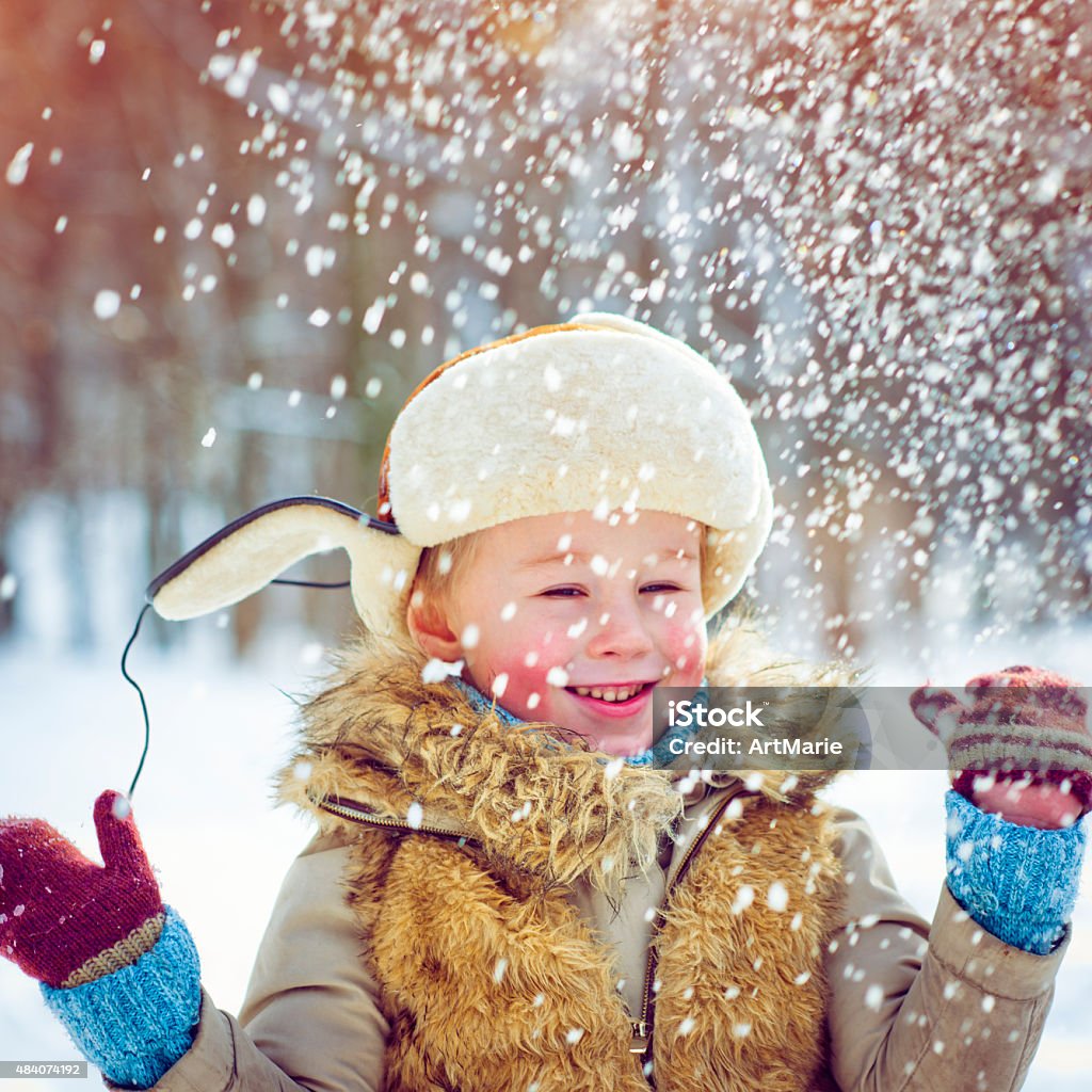 Fun in winter Little boy in winter park Boys Stock Photo