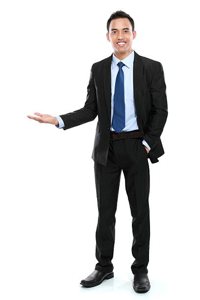istock smiling asian business man presenting a blank space 484077367