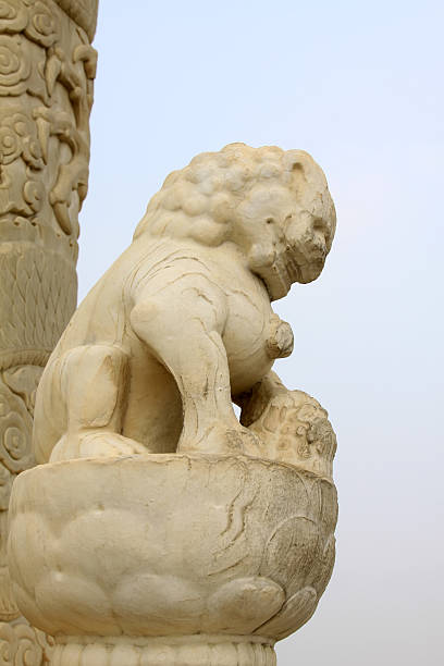 istock White marble lion sculpture in a park 484079769
