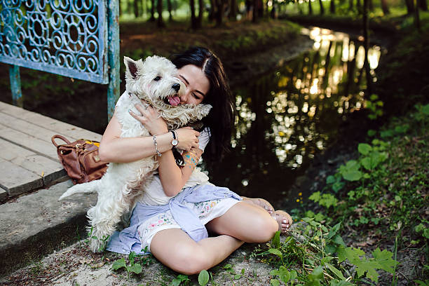 istock girl playing with a dog 484080008
