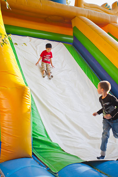 istock The little children on a trampoline. 484080373