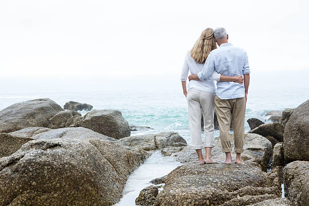 istock Happy couple standing on the rock 484080666