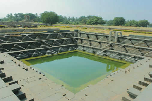 Stepped Royal bathing tank in royal enclosure in Hampi, Karnataka, India