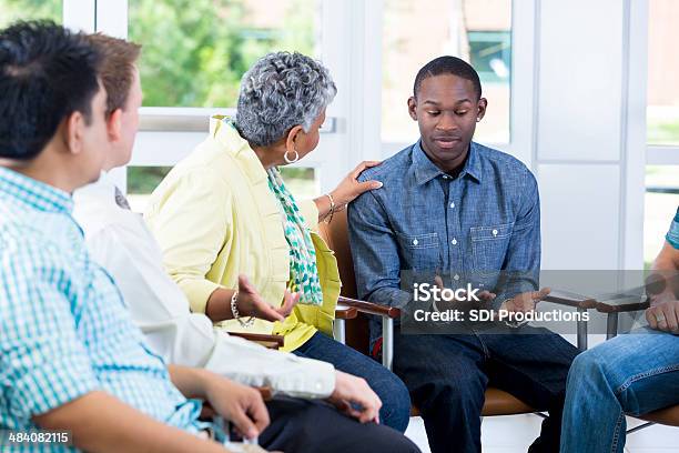 Teenager Explaining Problems In Group Setting Stock Photo - Download Image Now - Discussion, Psychotherapy, Talking