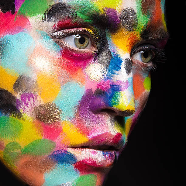 istock Girl with colored face painted. Art beauty image 484090468