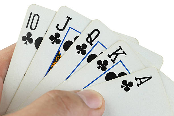 istock royal flush playing cards in hand. 484090510