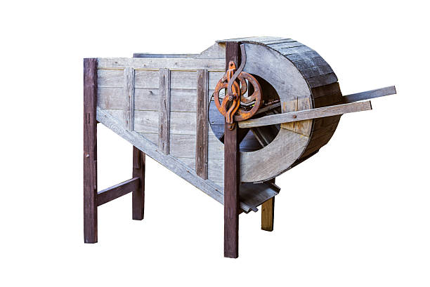 Old wooden rice milling machine on white isolate background.