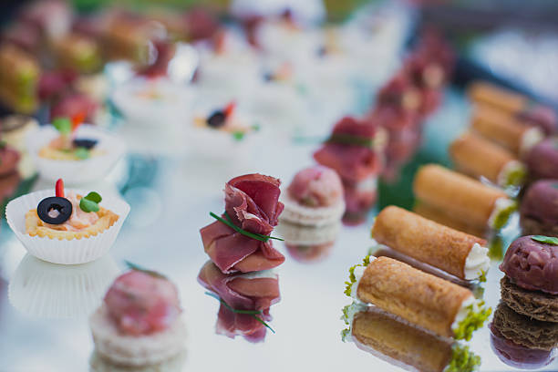 istock Beautifully decorated catering banquet table with different food snacks appetizers 484095144