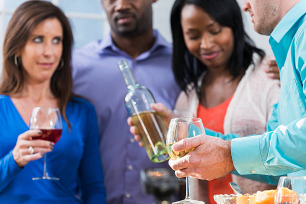 istock Group of friends drinking wine at a party 484101198