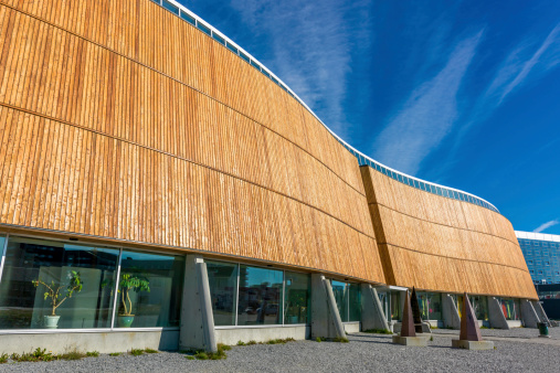 Modern Architecture Building with Wooden Facade under blue sky in the City of Nuuk - Godthab, Capital of Greenland.
