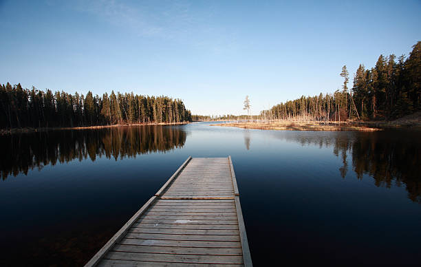 Dock on Northern Manitoba lake stock photo
