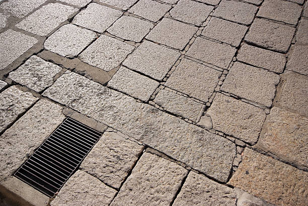 istock Steel grating on cobbled street 484103543