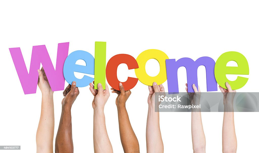 Multi-Ethnic Group Of People Holding The Word Welcome  Welcome Sign Stock Photo