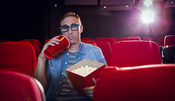 istock Young man watching a 3d film 484104444