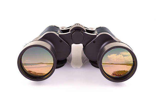 istock black binoculars and beach isolated on a white background 484107209