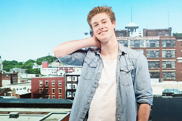 istock Smiling man standing in front of city 484107321