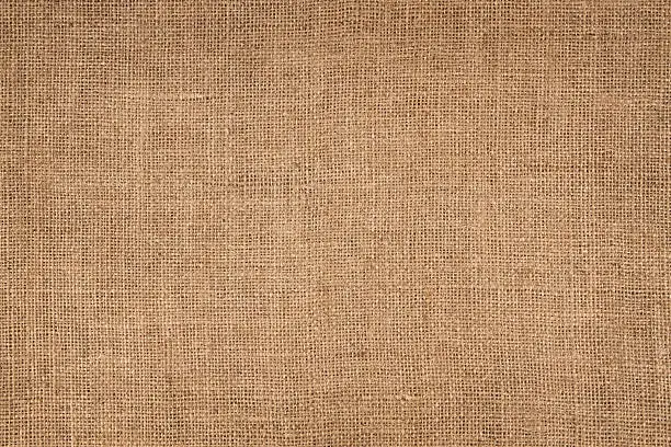 Natural linen striped, coloured, and textured sacking burlap background.