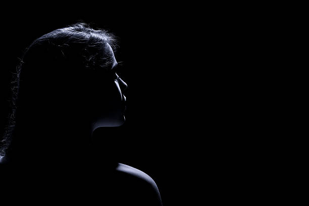 istock woman in dark 484109124