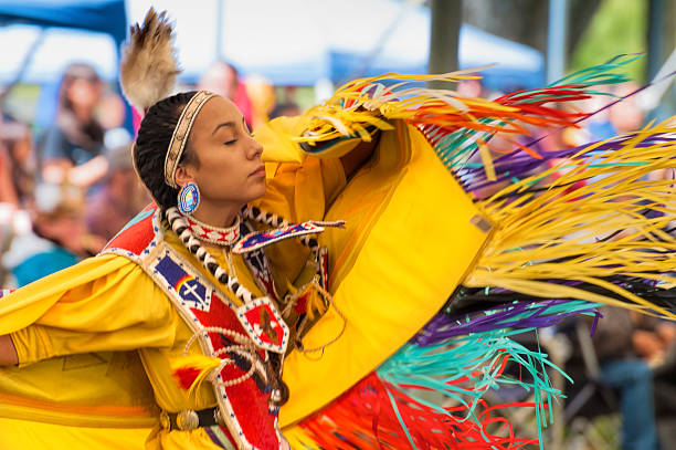 Close up of Dancing Native American Woman Portland, Oregon,USA- June 14, 2014: A closeup of a dancing Native American Woman with her eyes closed at the annual Delta Park Pow Wow in Portland, Oregon. indigenous north american culture photos stock pictures, royalty-free photos & images