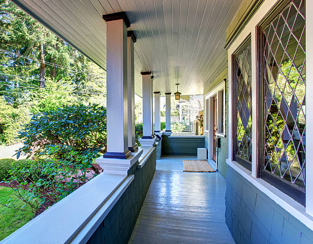 istock Perfect covered front porch woth decorative windows. 484115596