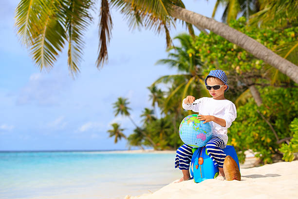 istock little boy travel on summer beach 484115860