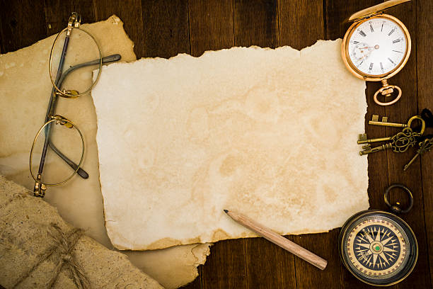 istock Old paper, compass, pocket watch on wooden background 484119022