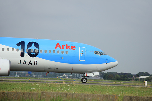 Amsterdam, The Netherlands - August 10 2015: PH-TFC Arke TUI Boeing 737-800  taxing on the Polderbaan runway to the main terminal of Amsterdam Schiphol Airport