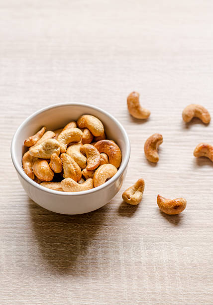 istock Close up cashew nuts on wooden background 484124816