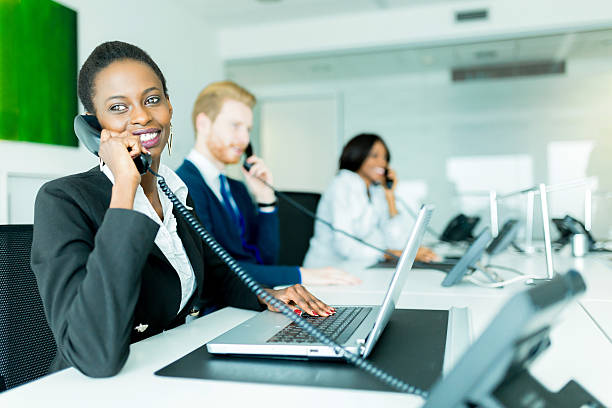 istock Beautiful, black, young woman working at a call center 484124872