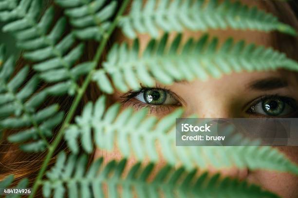 Portrait Of A Smiling Happy Beauty Girl Holding Leaf Fern Stock Photo - Download Image Now