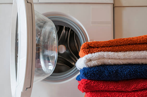 istock Washing machine and towels 484124972