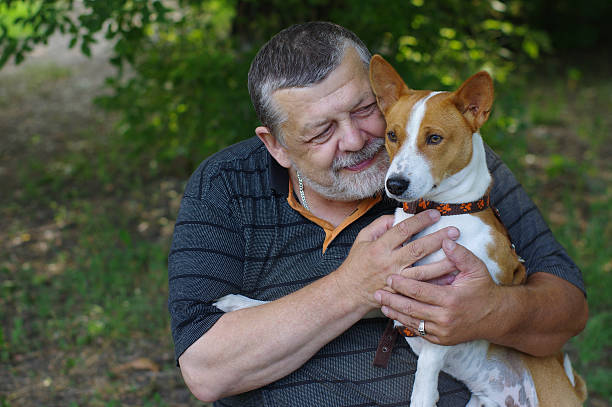 istock Bearded senior man with his cute dog 484125538